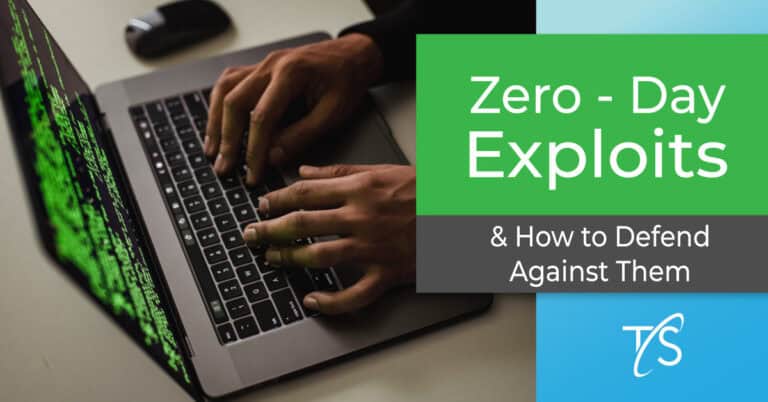 Malicious hacker typing on a laptop during a cybersecurity attack, highlighting zero-day exploits and defense strategies for businesses.
