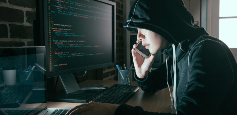 High-tech cybersecurity technician working on computer with coding and hacking prevention focus, IT security service, network protection, cybersecurity solutions, Twin State Technical Services.