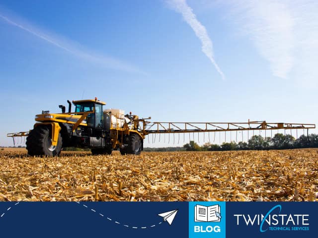 Sprayer tractor in a harvested farm field for agriculture AI technology, showcasing precision farming tools and real-world applications by Twin State Technical Services.